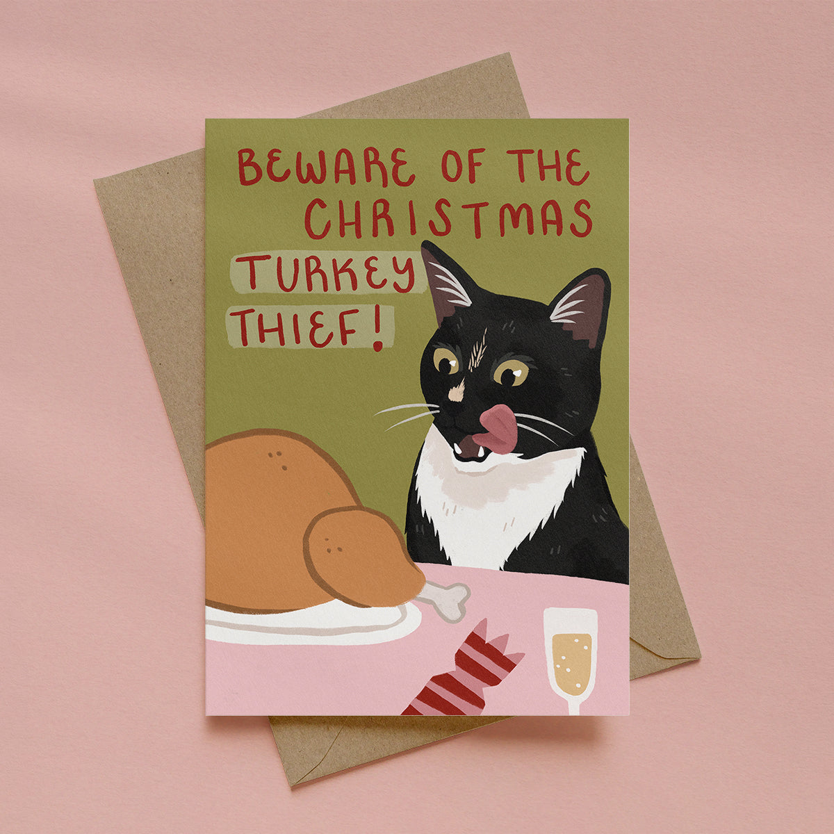 Christmas greetings card with a black cat eyeing a roast turkey and the text “Beware of the Christmas Turkey Thief!”