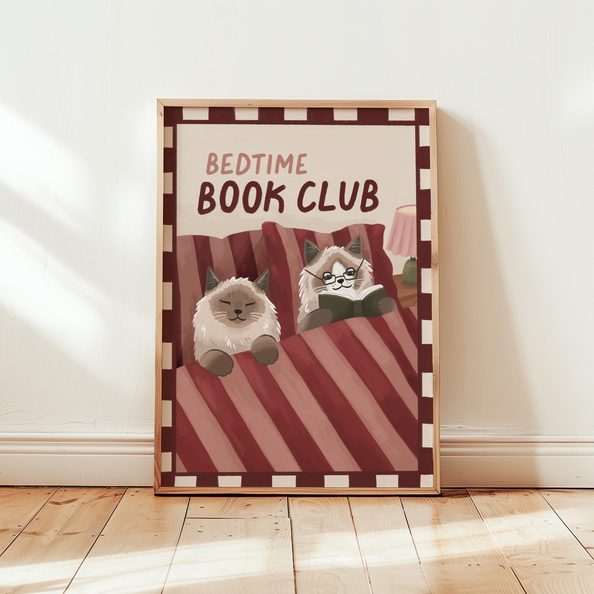 Bedtime Book Club cat print, unframed; red striped bedding with two cats reading