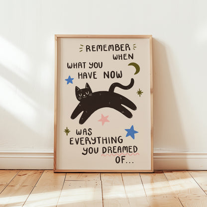 Full light beige cat motivation wall print with black cat, stars, and quote text