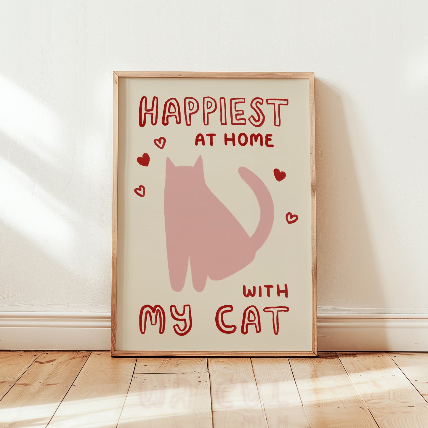 Happiest at Home print with pink cat and red hearts, “with my cat” in light wood frame