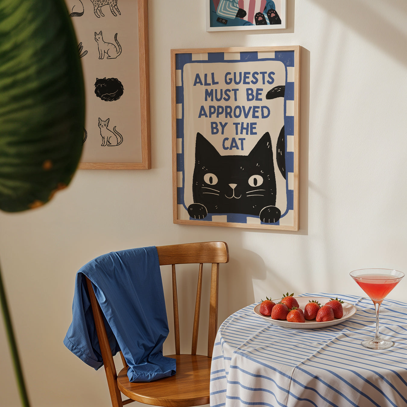 Framed cat approval print with blue border, black cat face and bold blue lettering