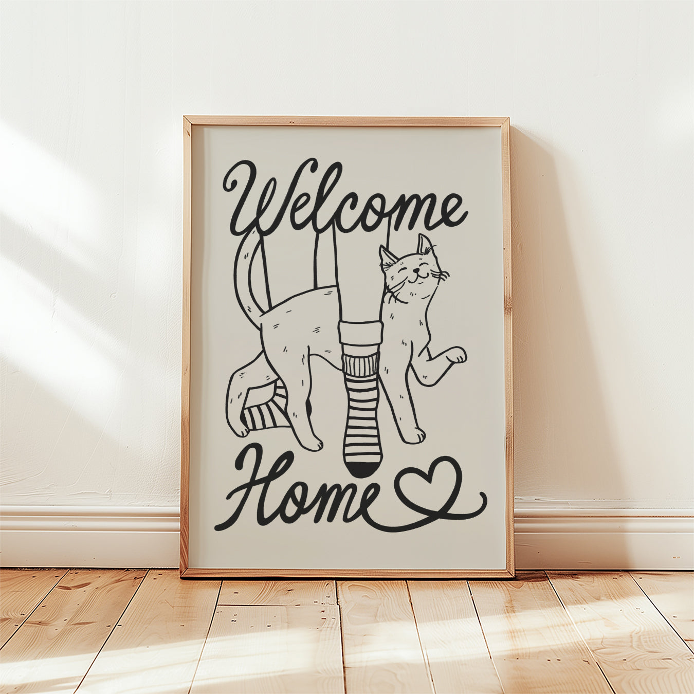 Framed Welcome Home cat lover print with two cats and heart, black line art on beige