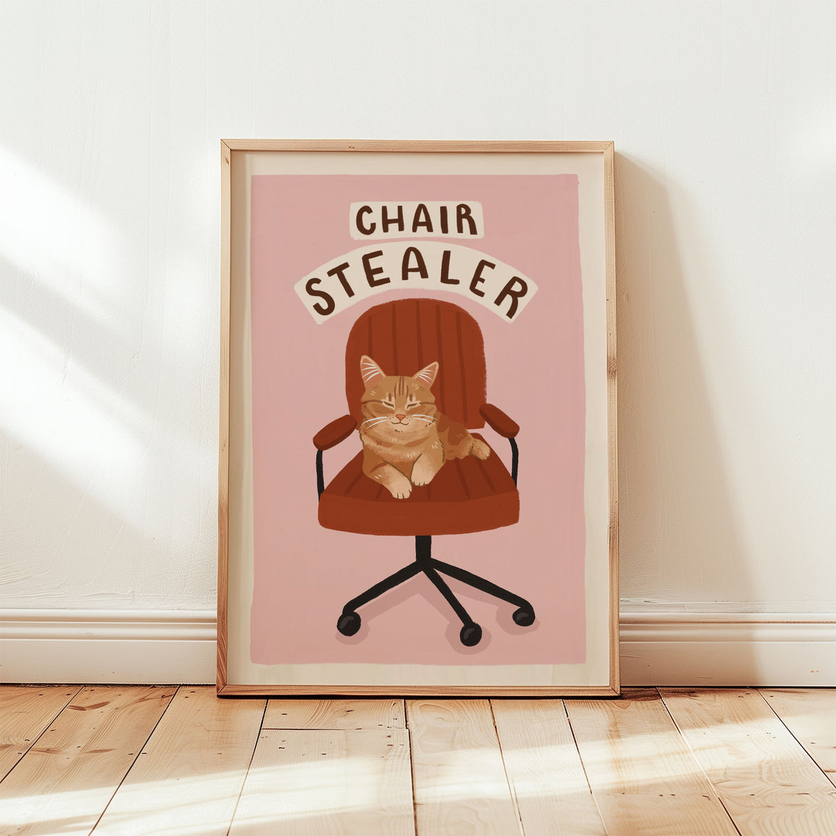 Cat office chair artwork print with orange tabby cat and 'CHAIR STEALER' text on pink