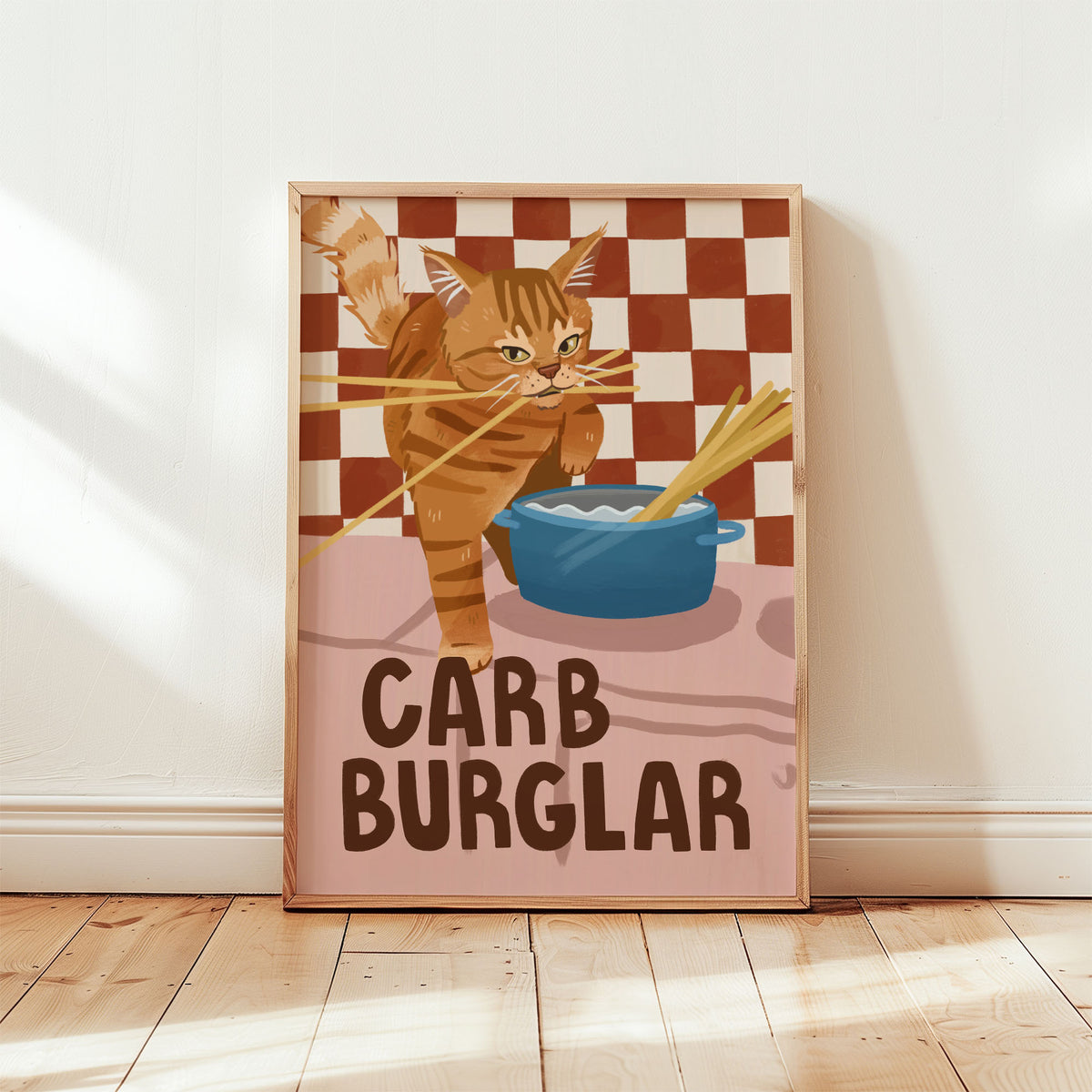 Cat wall art print with orange tabby burglar cat, blue bowl, checkered backdrop, “CARB BURGLAR”