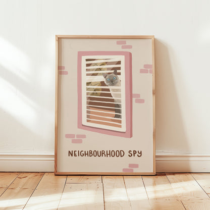 Framed cat spy print showing window bars and 'NEIGHBOURHOOD SPY' text, pink accents.