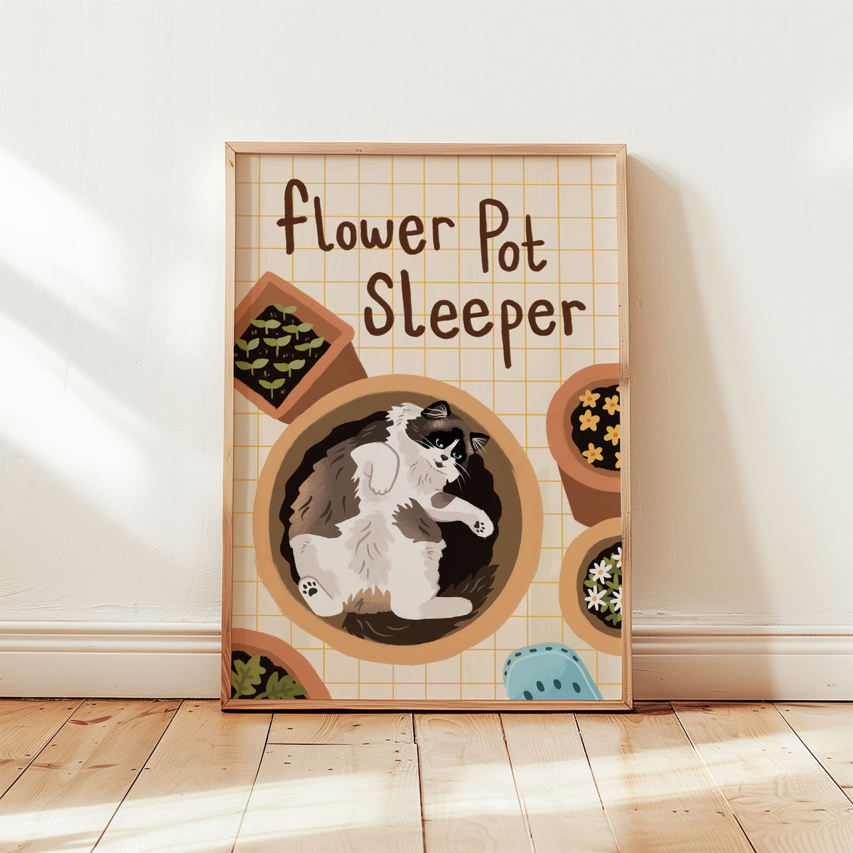 Framed cat gardening print featuring flower-pot pattern and black-and-white cat