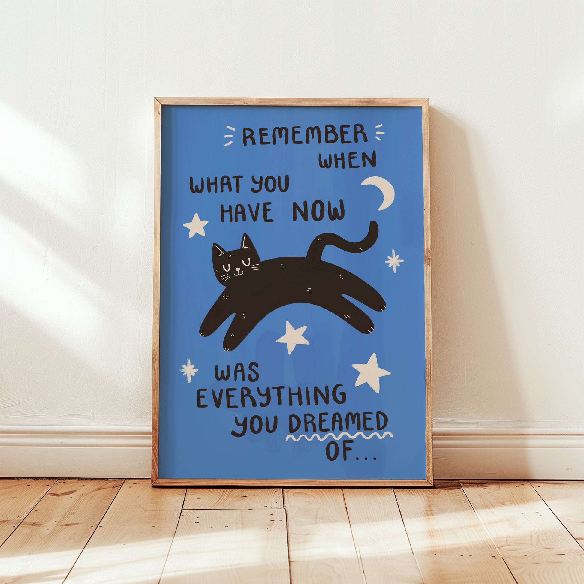 Full blue cat motivation wall print with black cat, stars, crescent moon, and quote text