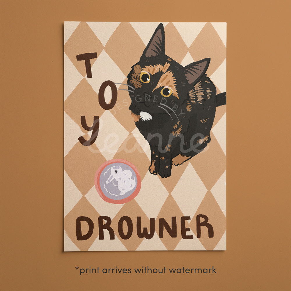 Cat print artwork with black-and-tan kitten in diamond pattern, 'TOY' and 'DROWNER' text