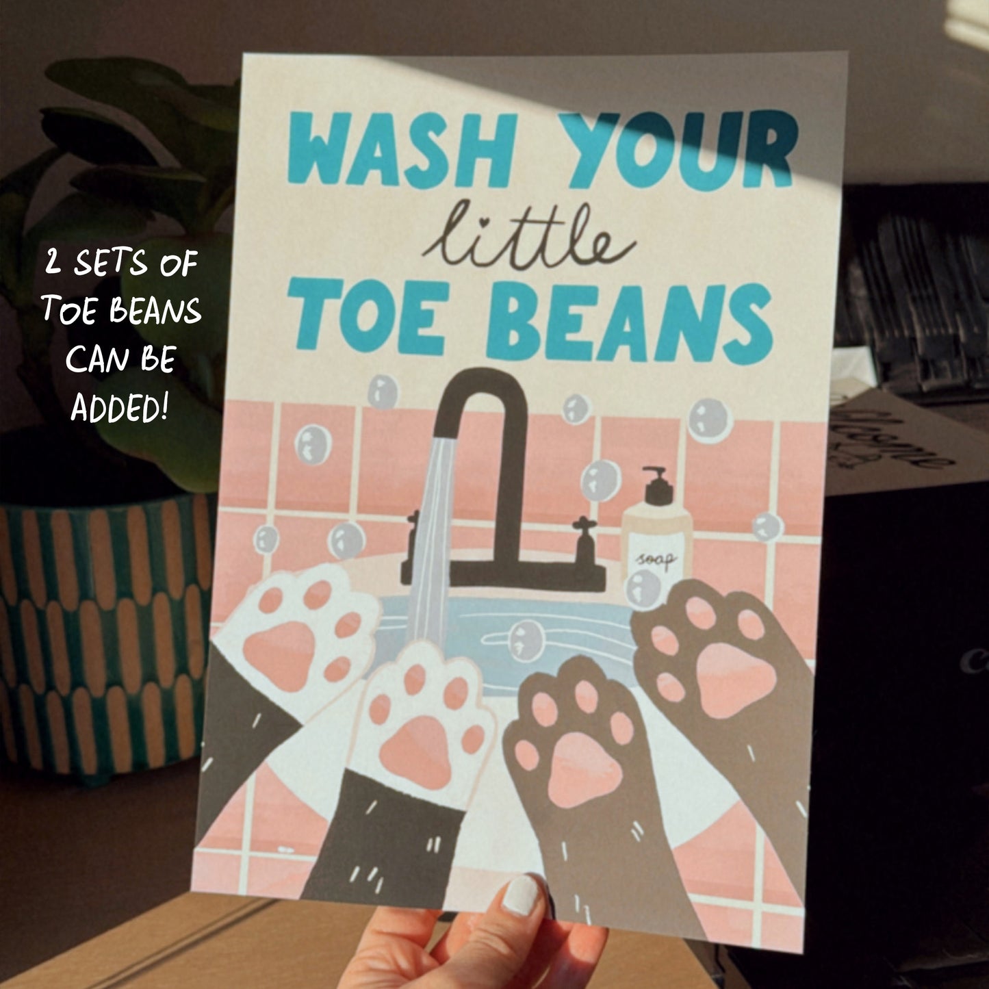 Framed wash your little toe beans print close-up with sink faucet and paw motifs