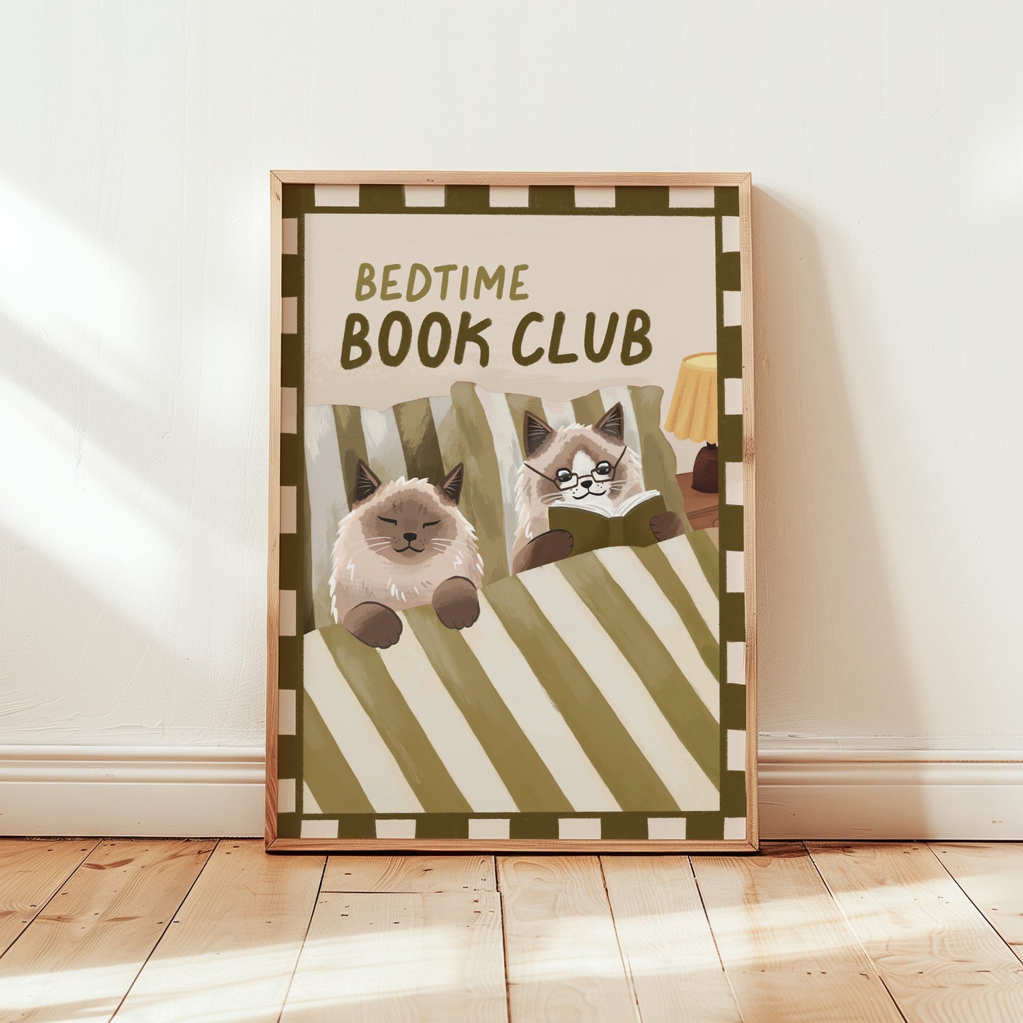 Bedtime Book Club cat print, unframed; green striped bedding with cats reading