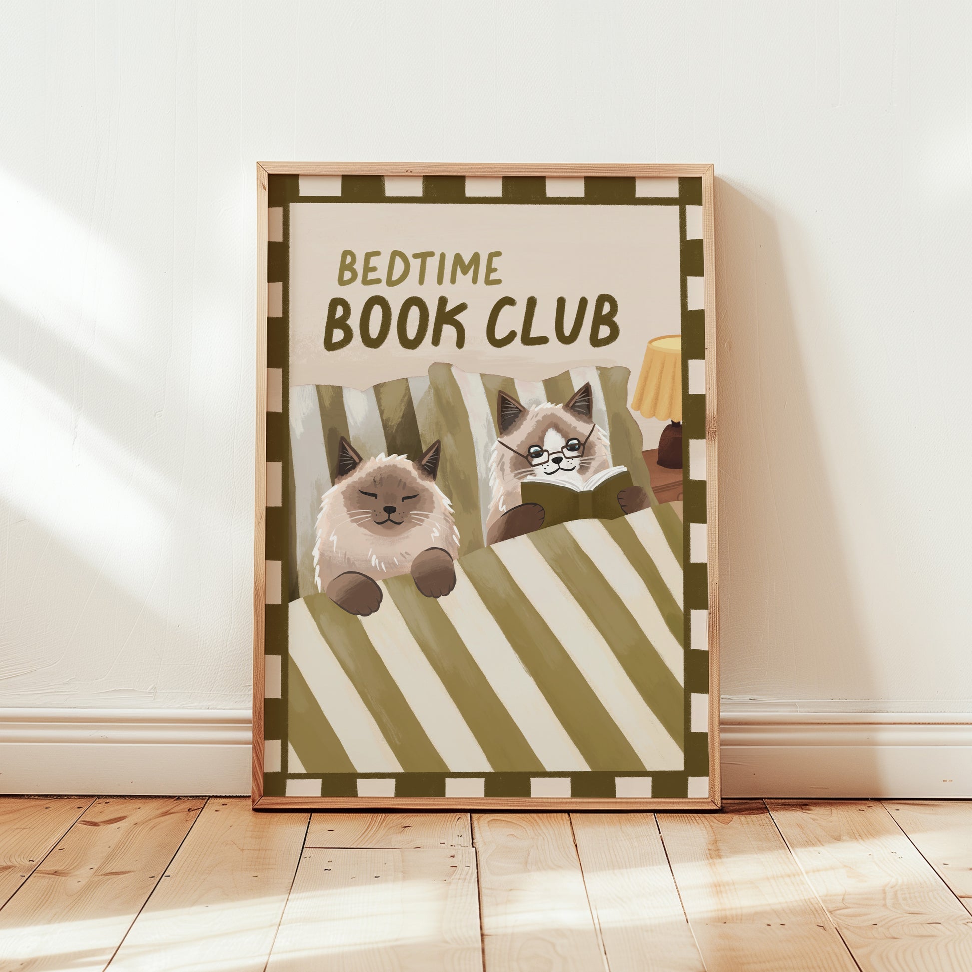 Bedtime Book Club cat print, unframed; green striped bedding with cats reading