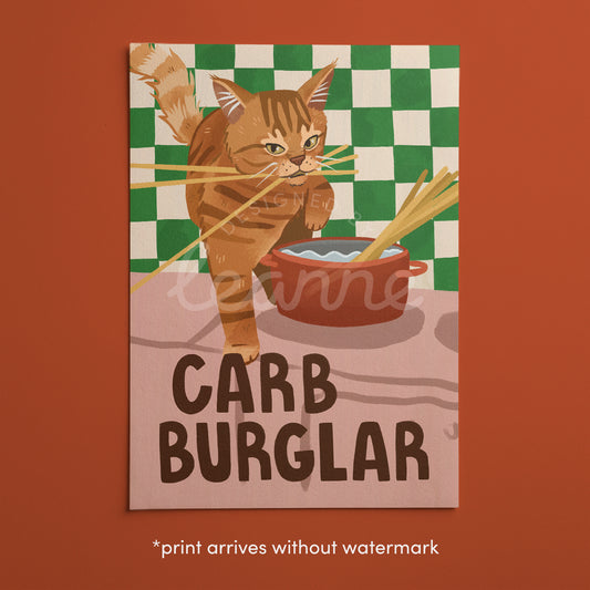Cat wall art print with orange tabby burglar cat carrying food bowl, “CARB BURGLAR”