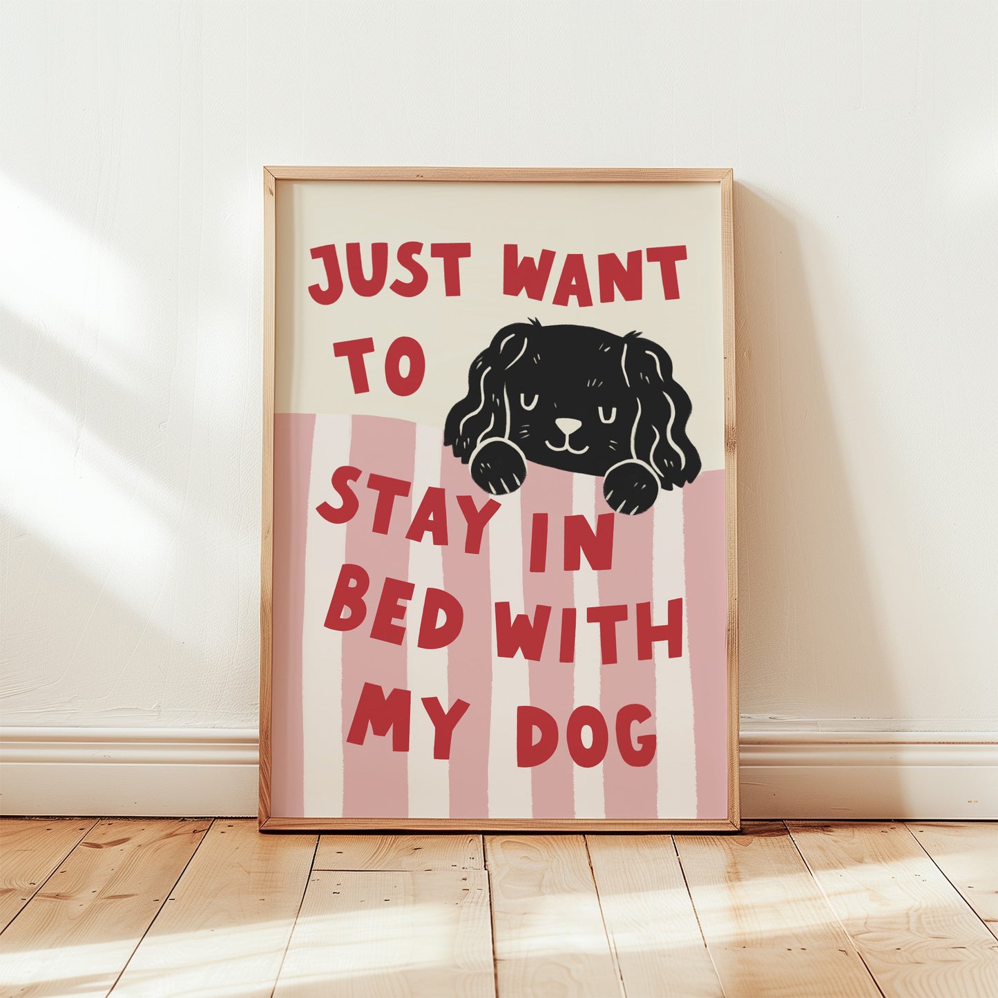 Framed “Just Want to Stay in Bed with My Dog” print with pink-and-white vertical stripes