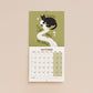 October page of cat-themed 2027 wall calendar with “Beware of the Loo Roll Menace”