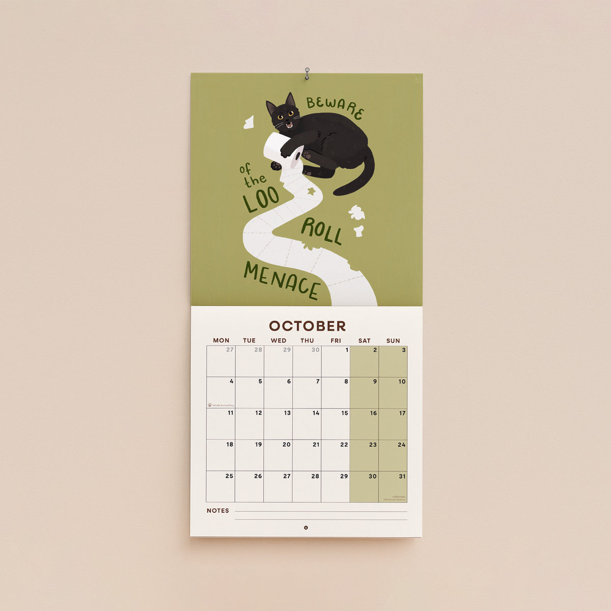 October page of cat-themed 2027 wall calendar with “Beware of the Loo Roll Menace”