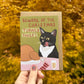 Christmas greeting card with a cat beside a roast turkey