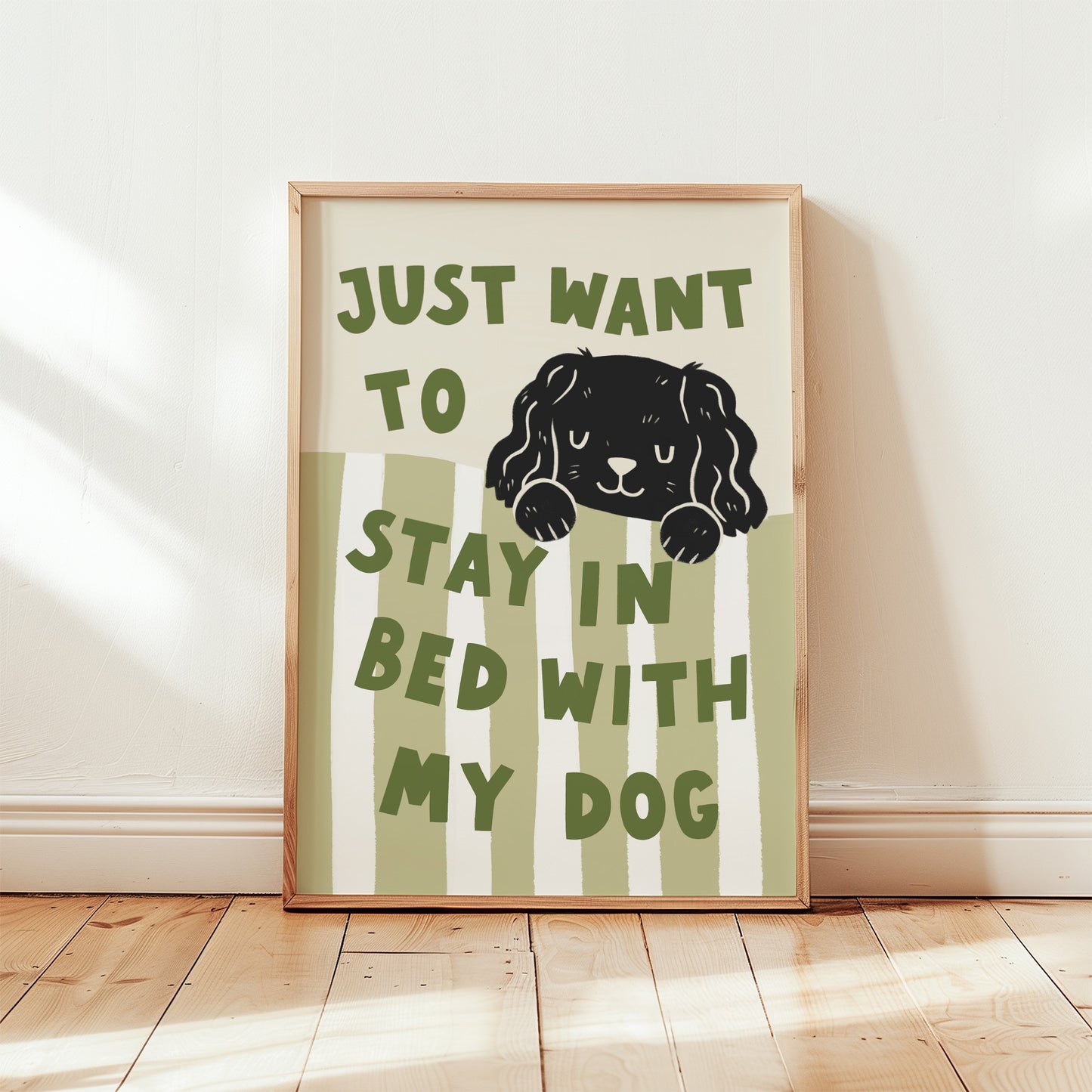 Framed “Just Want to Stay in Bed with My Dog” print in green-and-white stripes