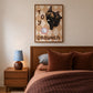 Cat print in small wall frame, black kitten illustration on tan diamond background with toy icon