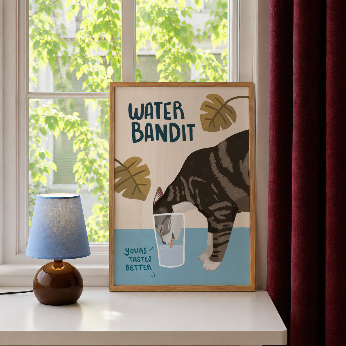 Unframed cat print with “WATER BANDIT,” tabby cat and water glass on a light background