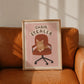 Cat office chair artwork print with orange tabby cat, 'CHAIR STEALER' text, in frame