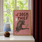 Framed cat print with 'SOCK THIEF' text, gray cat and colored sock icons