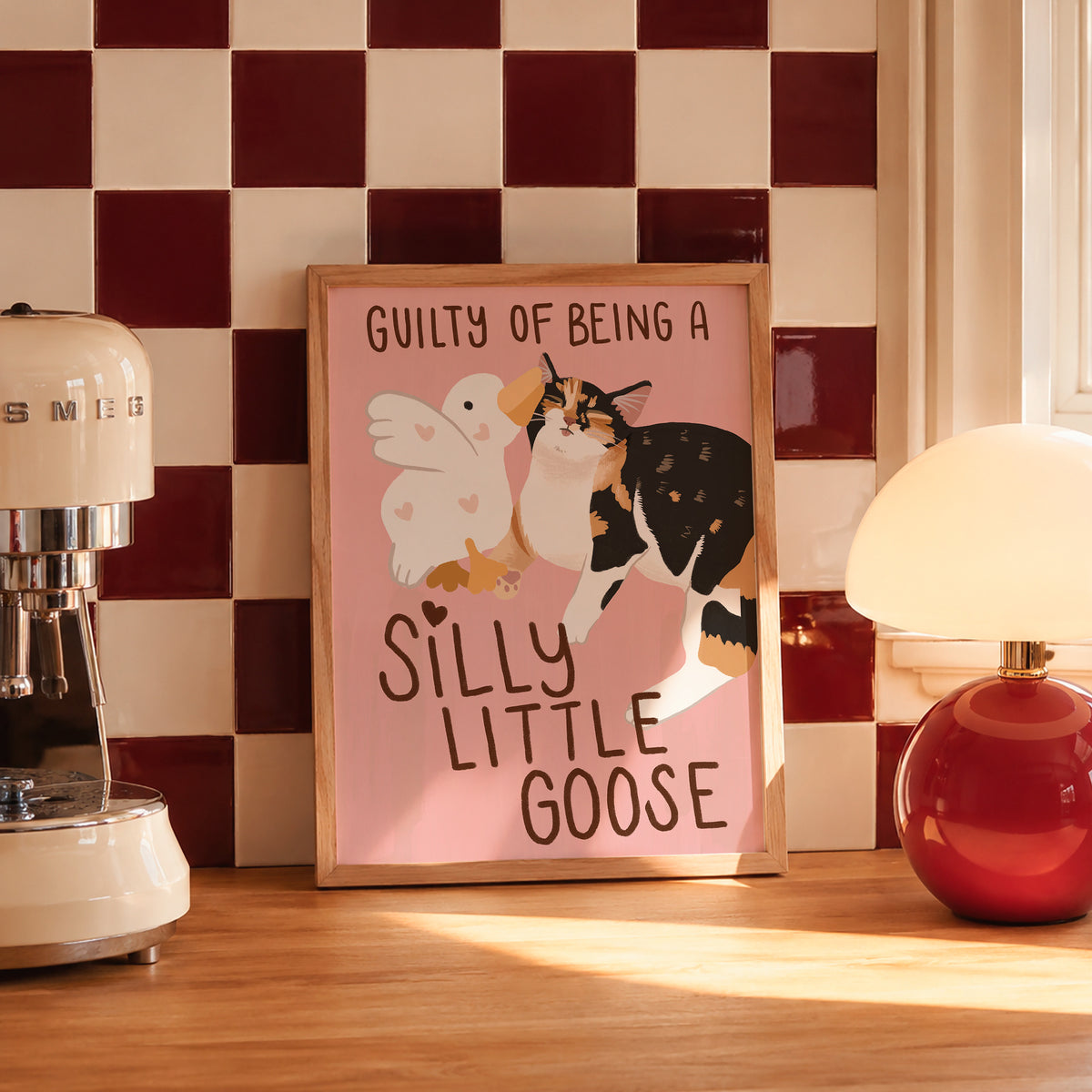 Unframed goose and cat illustration print with “Silly Little Goose” on pink paper