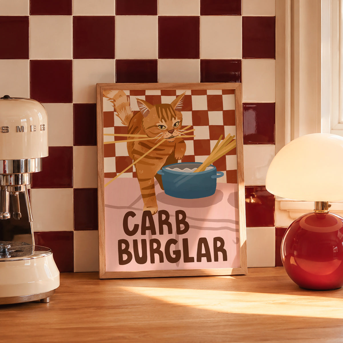 Cat wall art print with orange tabby burglar cat and blue food bowl, “CARB BURGLAR”