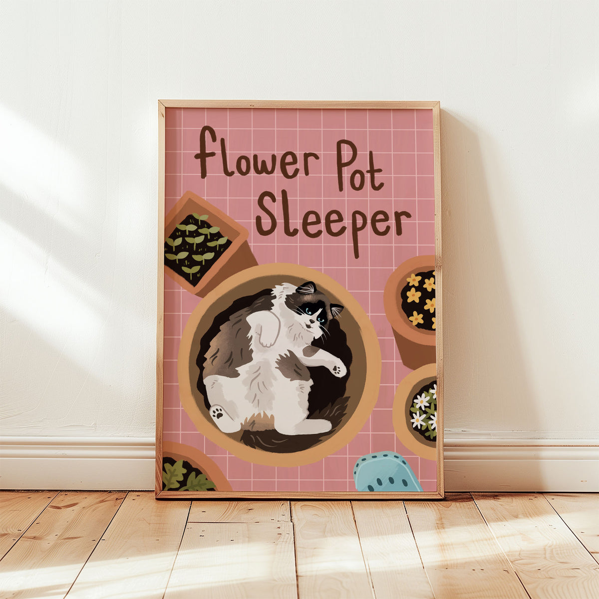 Framed cat gardening print with flower-pot pattern and black-and-white cat illustration