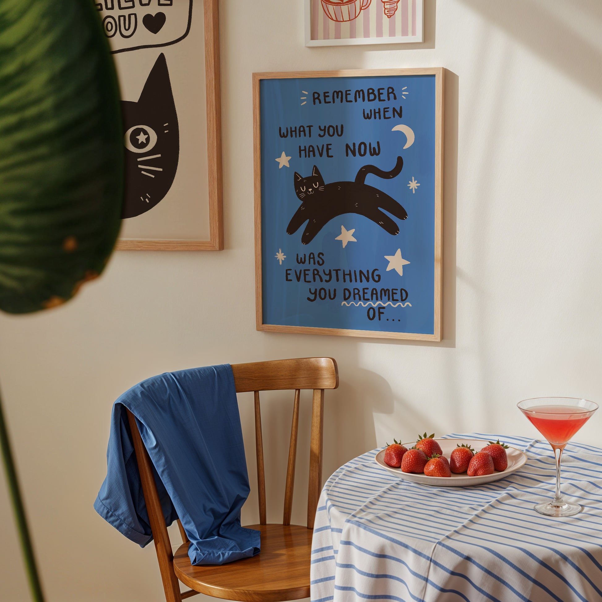 Blue cat motivation wall print with black cat, crescent moon, and motivational quote text