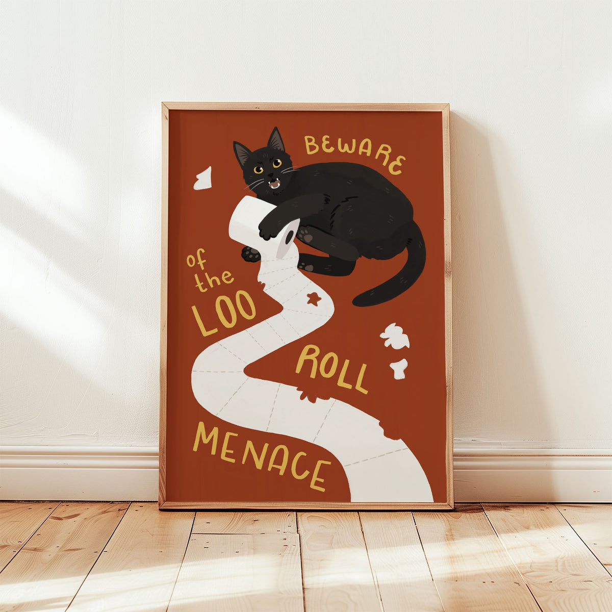 Cat bathroom print: black cat on toilet paper, orange background, framed border