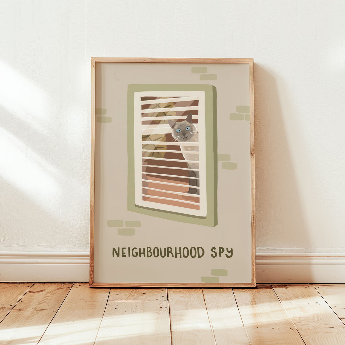 Framed cat spy print featuring window bars and 'NEIGHBOURHOOD SPY' text, green-themed accents.