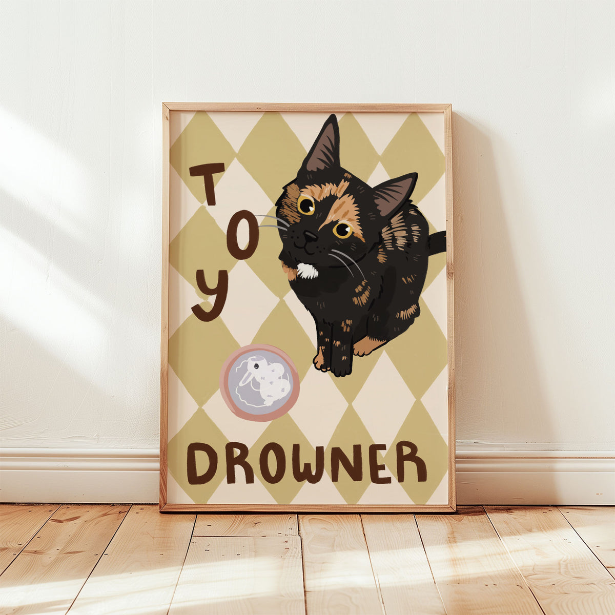 Cat wall art with black kitten and tan-pink diamonds; pink toy icon and 'DROWNER' text
