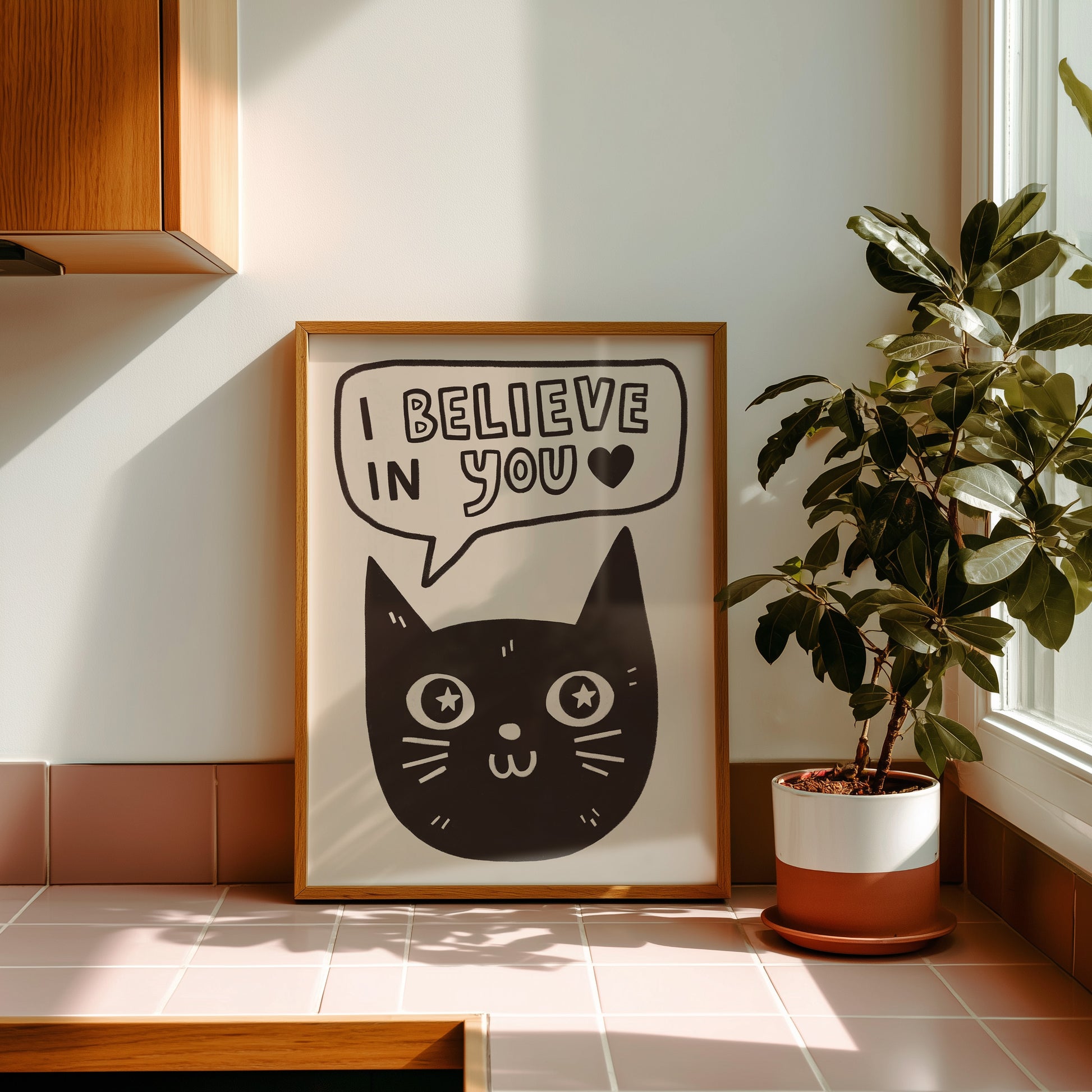 Unframed cat print wall art with black cat face and “I Believe in You” on light background, heart in bubble
