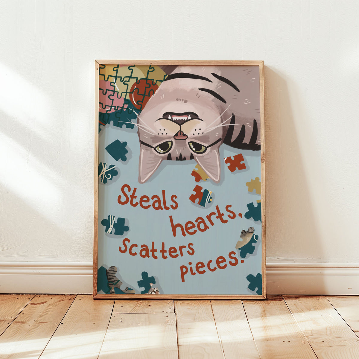 Unframed cat puzzle print showing a cartoon cat face with puzzle pieces and heart-themed text