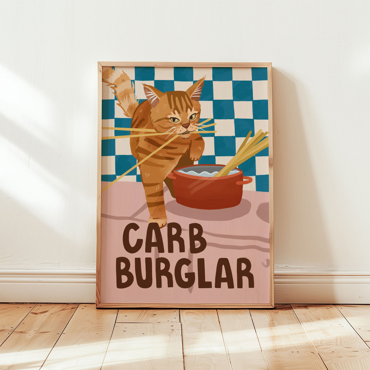 Cat wall art print with orange tabby burglar cat, red bowl, checkered backdrop, “CARB BURGLAR”