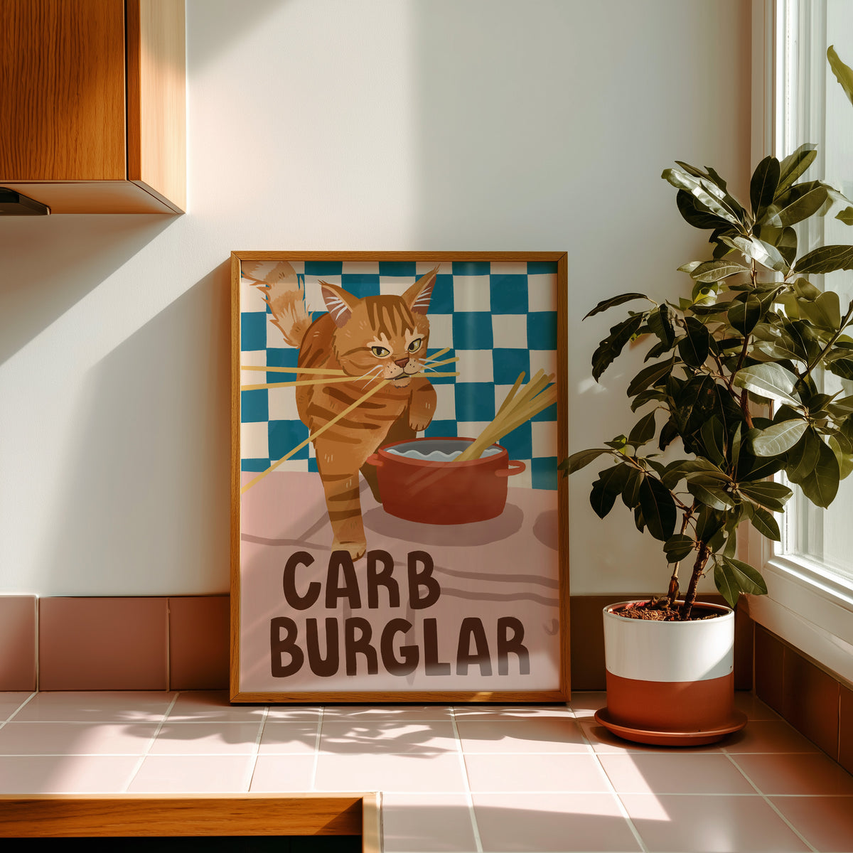 Cat wall art print with orange tabby burglar cat, red bowl, checkered backdrop, “CARB BURGLAR”
