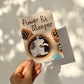 Handheld cat gardening print with flower-pot theme and black-and-white cat illustration