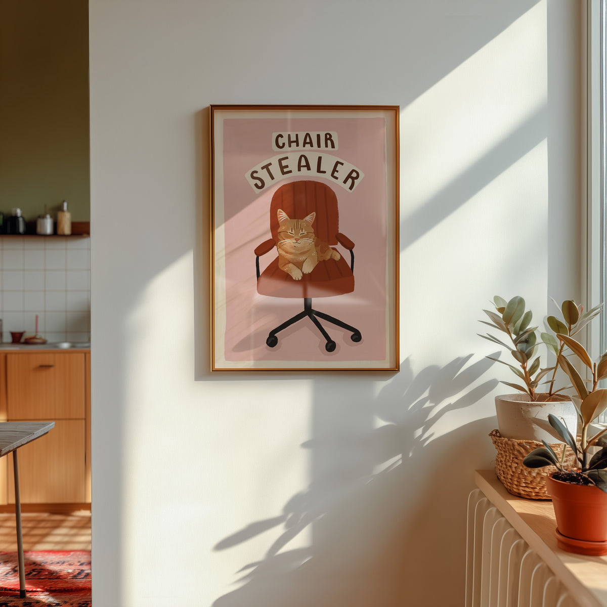 Framed cat office chair artwork print with orange tabby cat and 'CHAIR STEALER' text