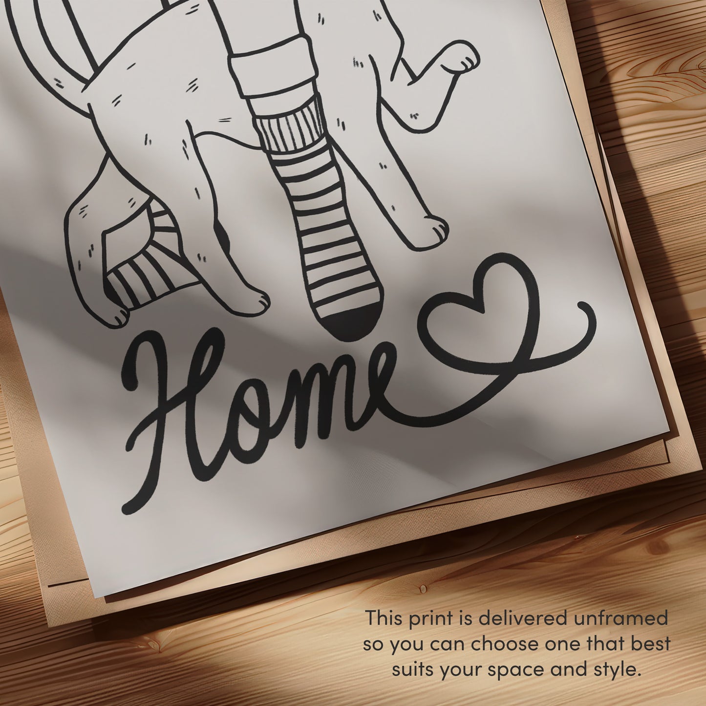 Close-up cat lover print: 'Home' script with cats and heart, black line art on paper