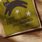 Close-up green cat motivation wall print with black cat silhouette and quote text
