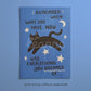 Close-up blue cat motivation wall print with black cat and handwritten quote text