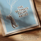 Close-up of cat wall art text "THE ULTIMATE ARTIST" with gray cat sticker illustration.