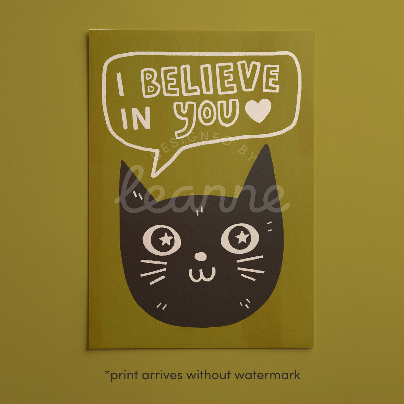 Unframed cat print wall art with black cat face, star eyes, and “I Believe in You” on green background