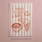 Framed print with pink-and-cream stripes, “I think I deserve a little treat” text and croissant