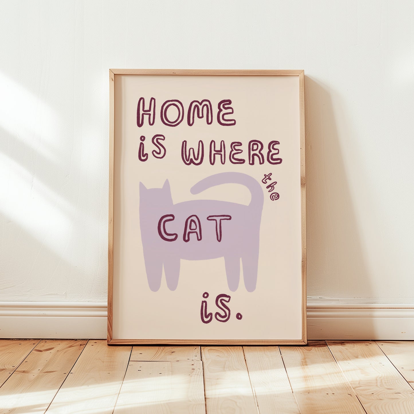 Home Is Where The Cat Is print: purple cat silhouette with red “HOME” text, framed