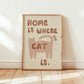 Home Is Where The Cat Is print: brown cat illustration with red-brown lettering, framed